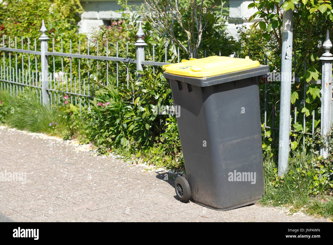 Yellow Recycling Bin for plastic Waste Stock Photo - Alamy