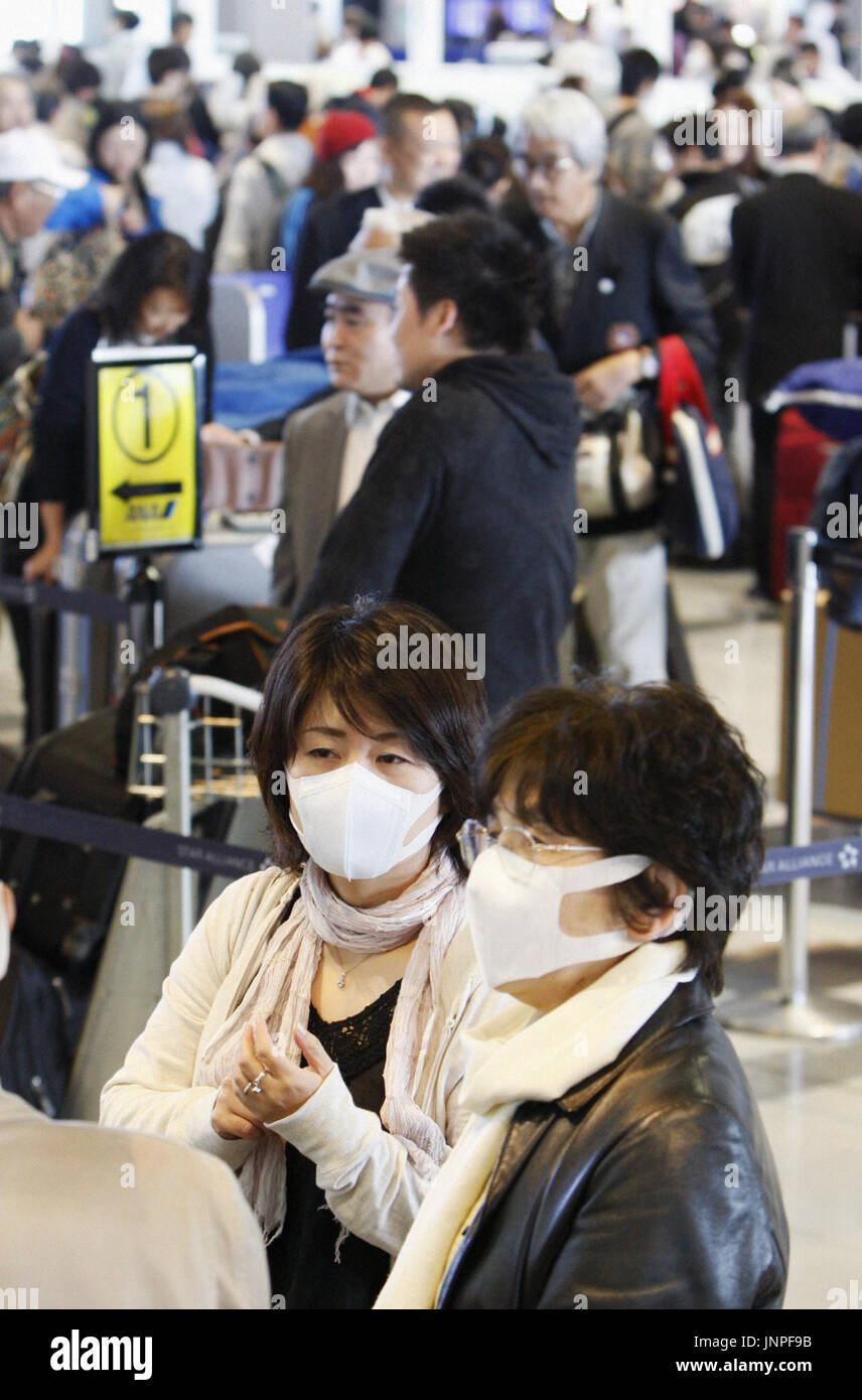 TOKYO, Japan - Travelers wear face masks at a departure lobby at Narita ...