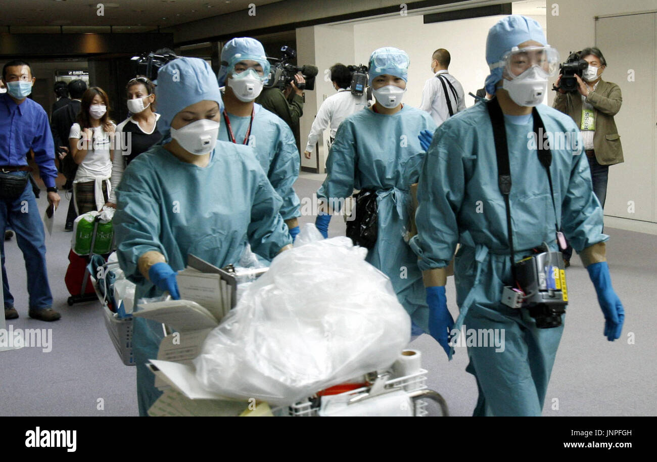 NARITA, Japan Quarantine officers head back to the terminal at Narita