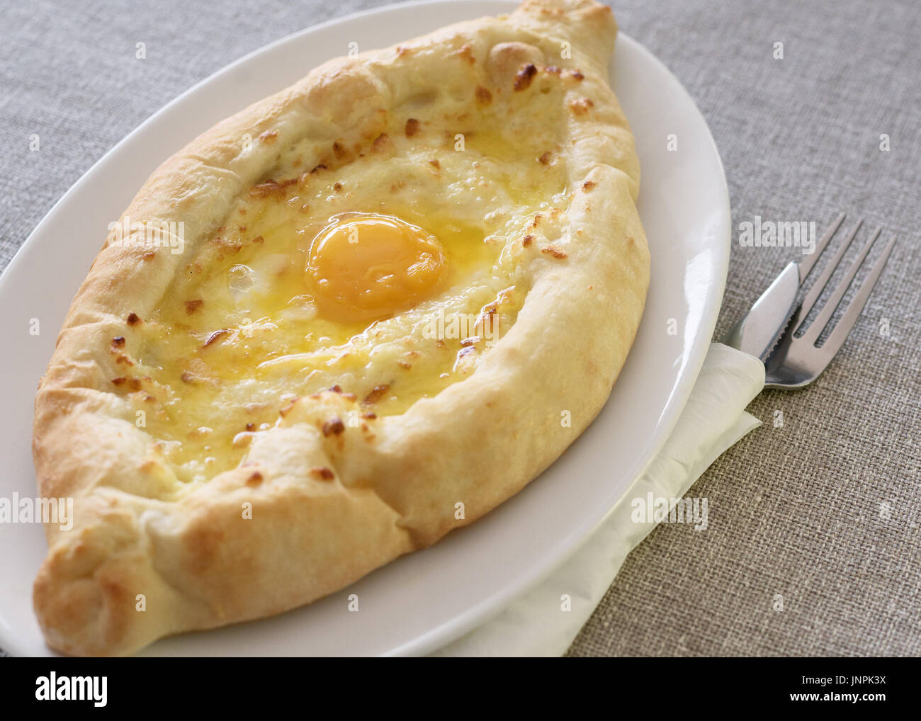 Ajarian khachapuri forms boats, Georgian cuisine Stock Photo