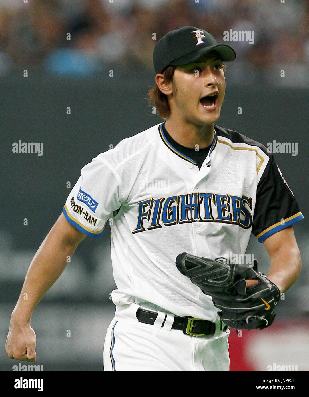 SAPPORO, Japan - Nippon Ham Fighters ace Yu Darvish reacts after striking  out Chunichi Dragons third baseman Masahiko Morino in the eighth inning of  their game in Sapporo Dome on June 13.