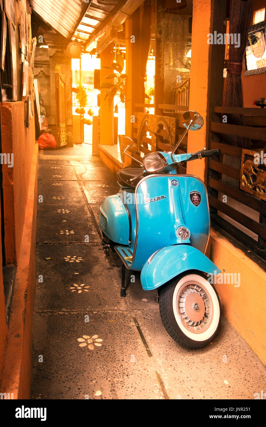 Bali, Indonesia - July 04, 2017. Blue Vespa brand scooter in a place in Ubud Bali Idonesia. Stock Photo