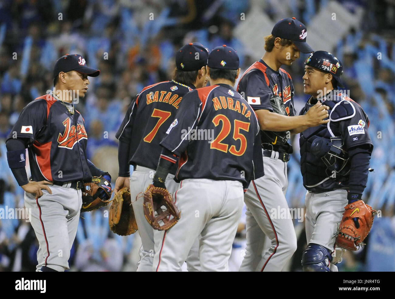 SAN DIEGO, United States - Japan players gather at the pitching mound after pitcher Yu Darvish (2nd from R) allowed a run for South Korea in the first inning of their game in the World Baseball Classic second round at PETCO Park in San Diego, California, on March 17. (Kyodo) Stock Photo