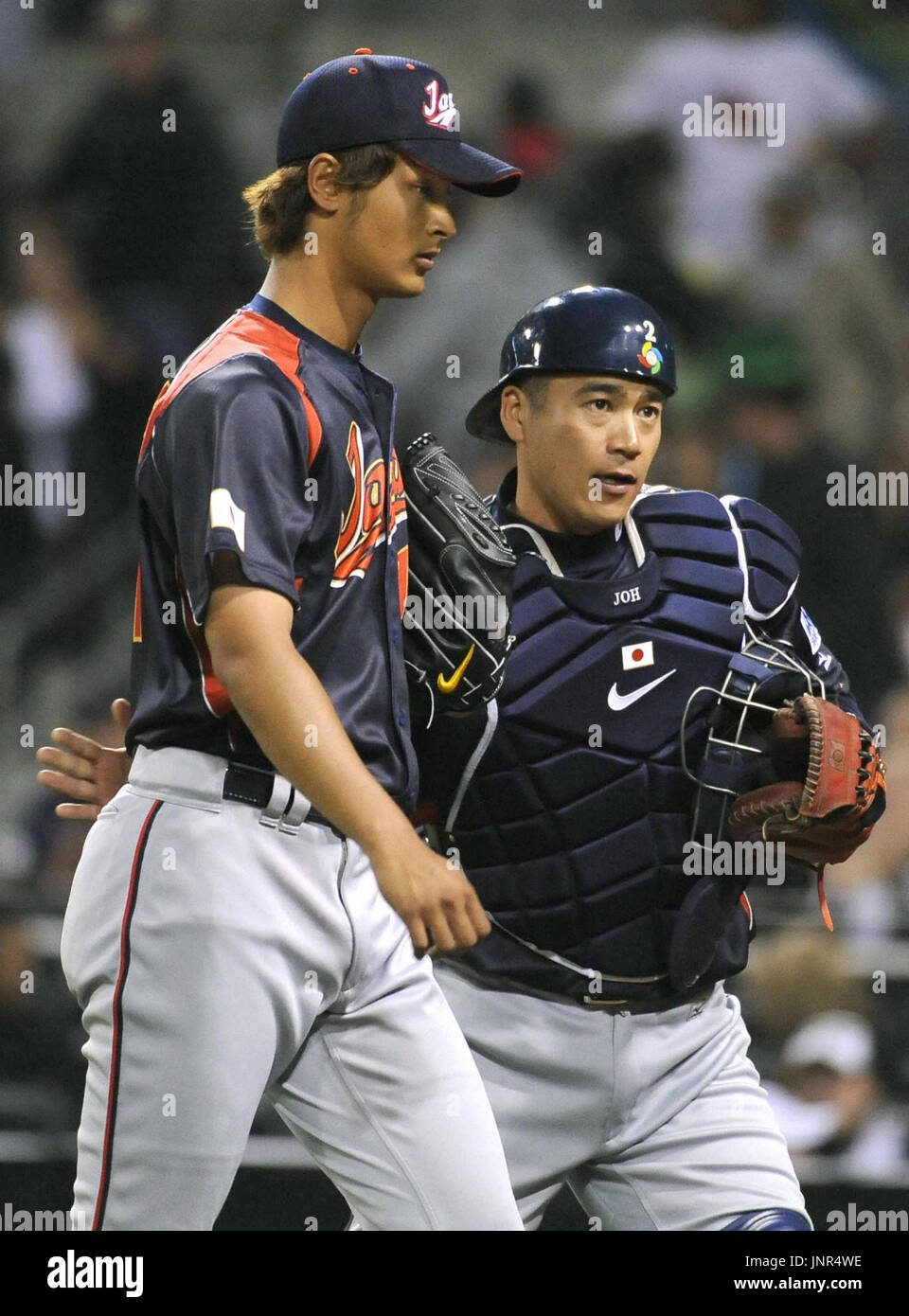 SAN DIEGO, United States - Japan pitcher Yu Darvish (L) heads to the ...