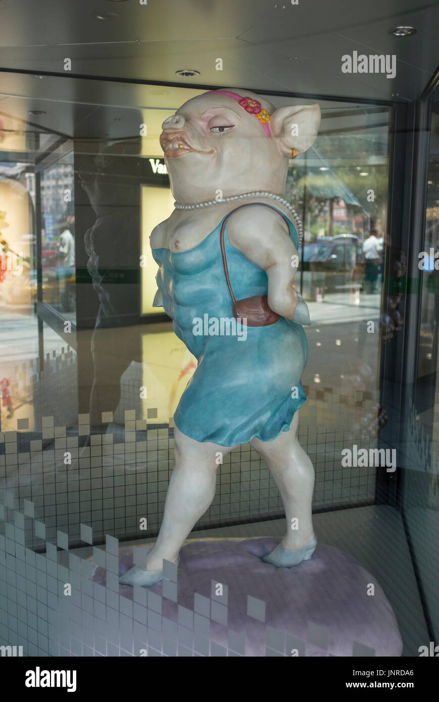 A sculpture featuring a fashionable pig lady going shopping at Parkview