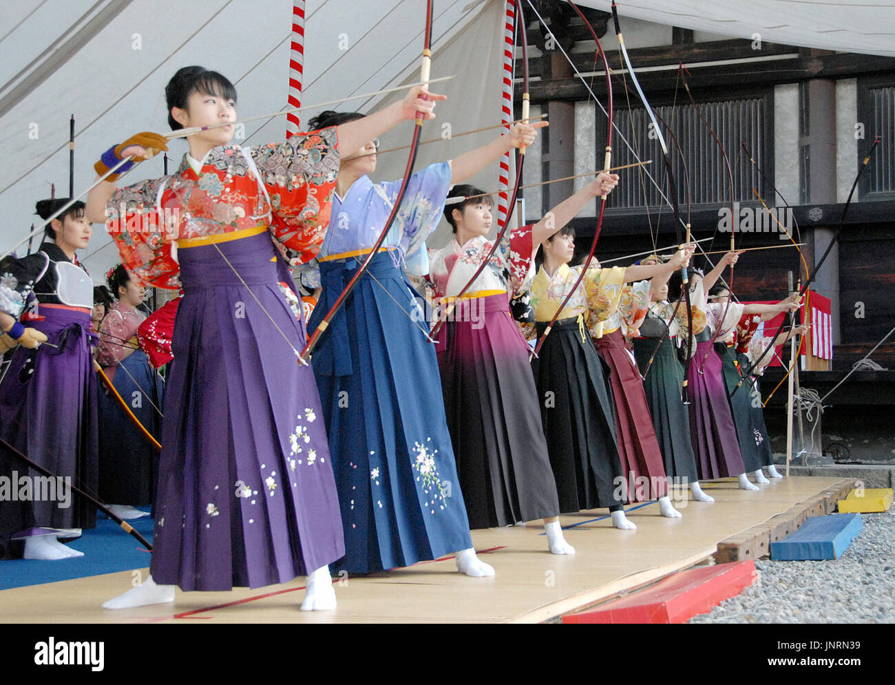 KYOTO, Japan Young female archers dressed in traditional kimono and