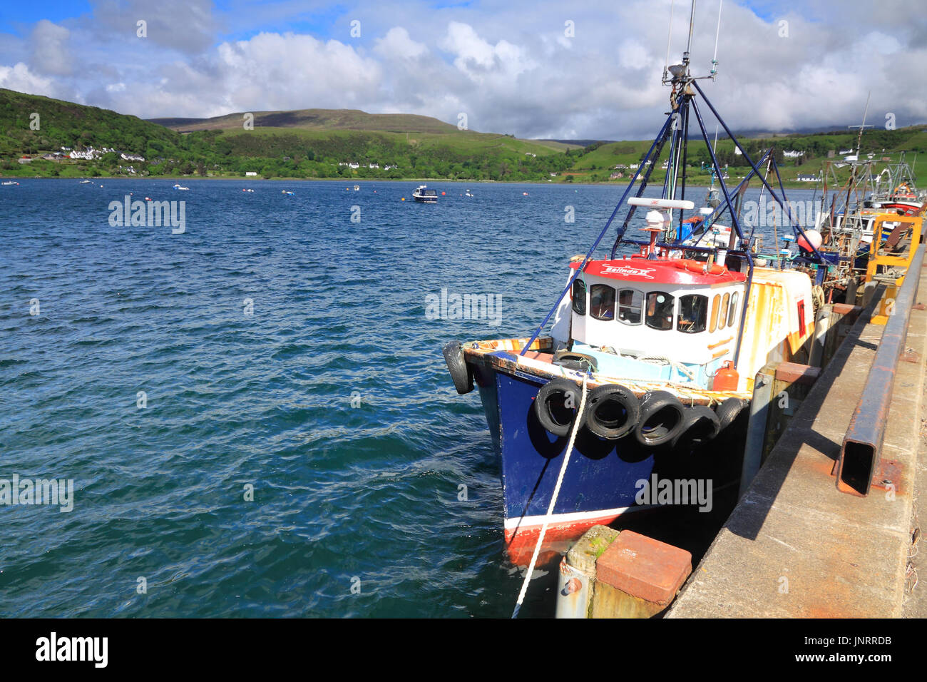 Fishing boat moored in Uig harbour, Isle of Skye, Scotland Stock Photo