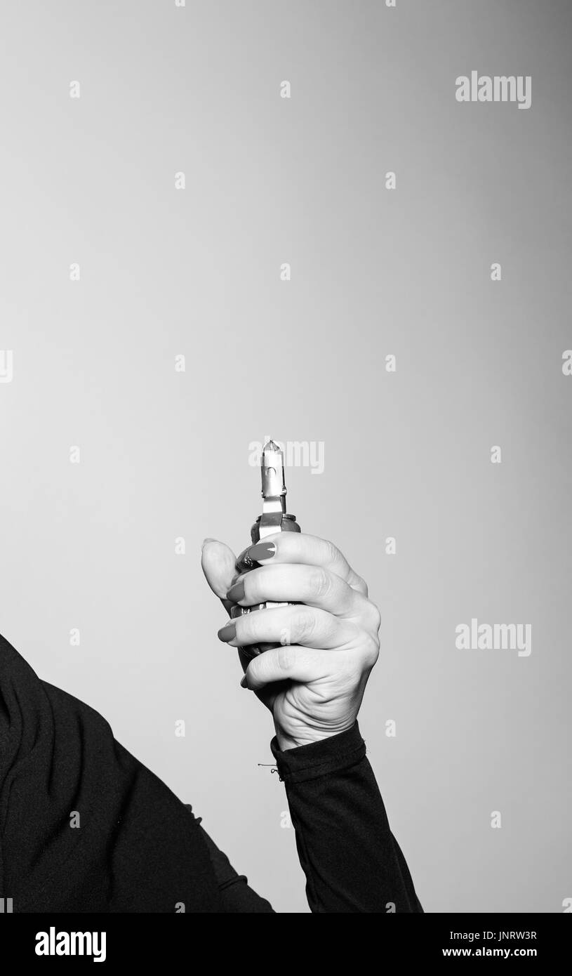 Close-up of hand holds a grenade Stock Photo