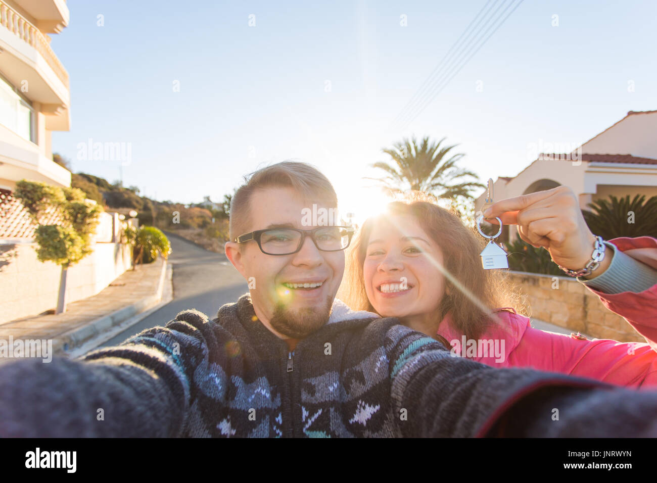 real estate: happy couple showing keys of their new house Stock Photo ...