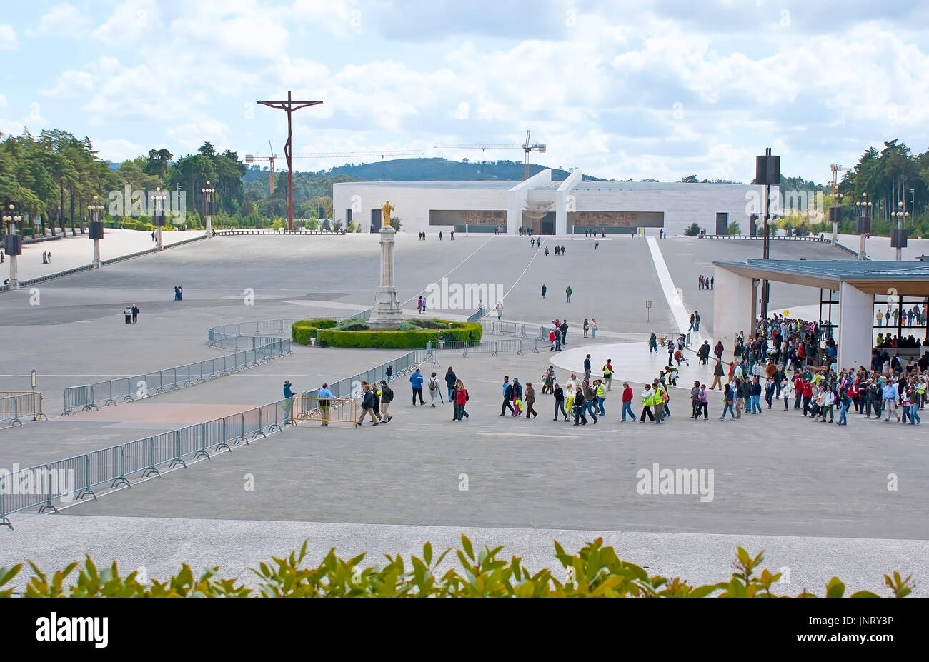 FATIMA, PORTUGAL - April 30, 2012: The tourist groups and pilgrims on territory of Sanctuary of Our Lady of Fatima, on April 30 in Fatima. Stock Photo