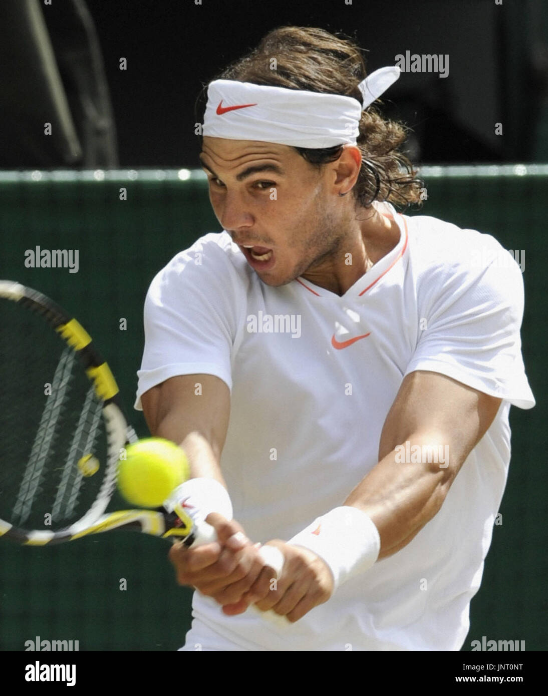 WIMBELDON, England - Rafael Nadal of Spain returns the ball to Tomas Berdych of the Czech Republic during the men's singles final at the Wimbledon tennis championships at the All England Tennis Club in London on July 4, 2010. Nadal won 6-3, 7-5, 6-4. (Kyodo) Stock Photo