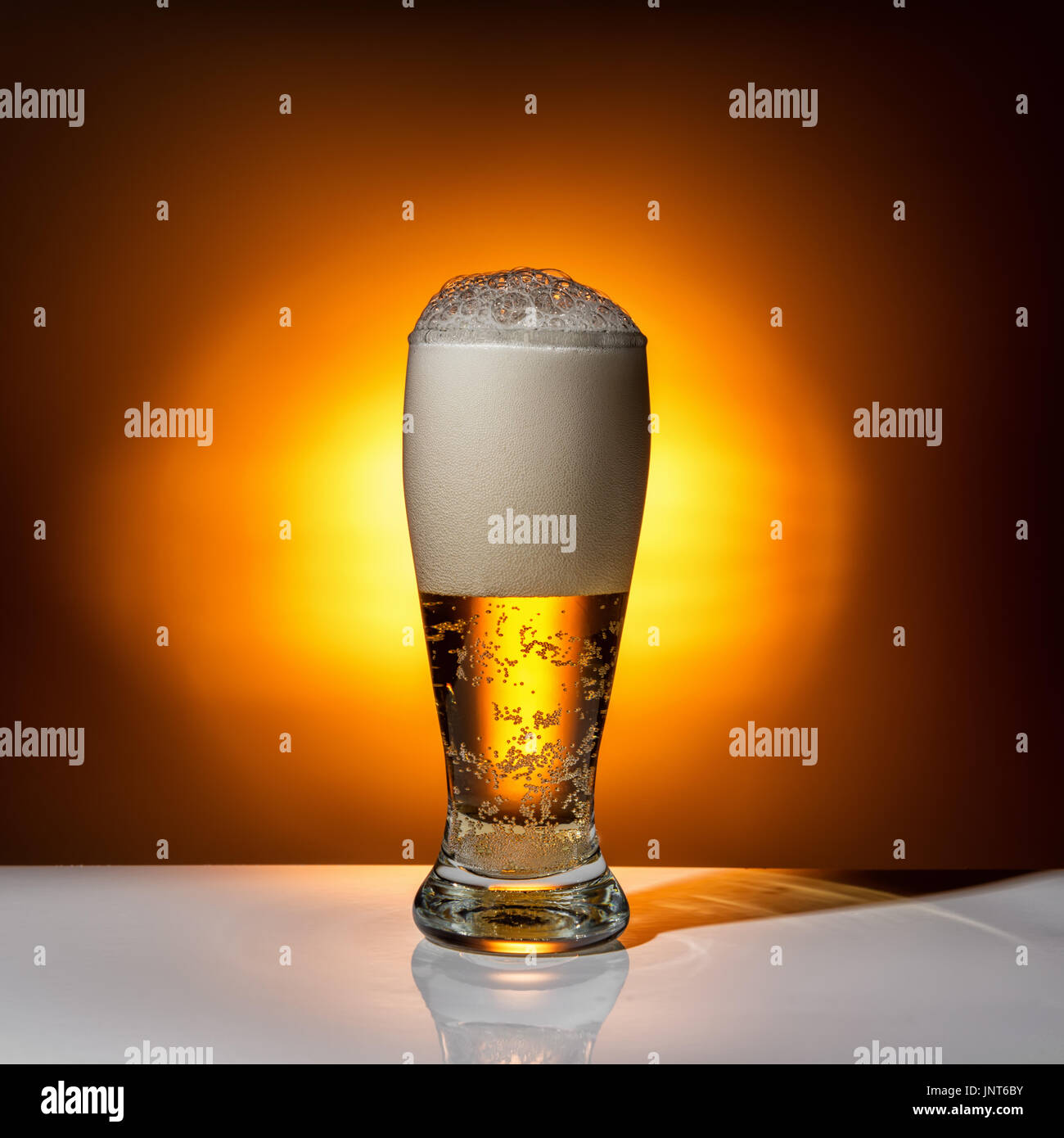 dark glass beer on light background, close up Stock Photo