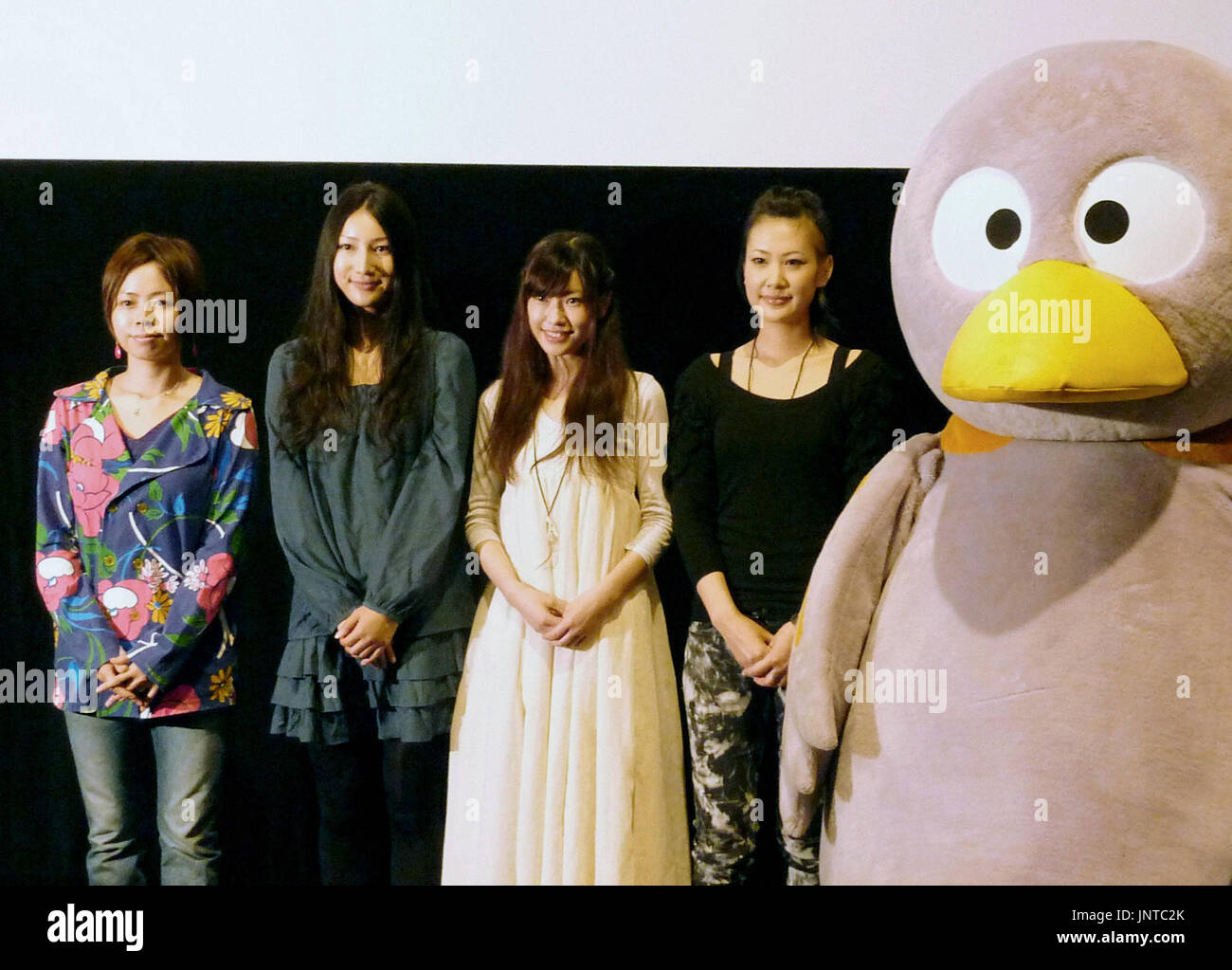 SAITAMA, Japan - Saitama Prefecture's dove mascot ''Kobaton'' poses for  photos with actress Marie Ono (3rd from L) and singer Uri Nakayama (L)  during a screening of the film ''Nemuriba'' (place to