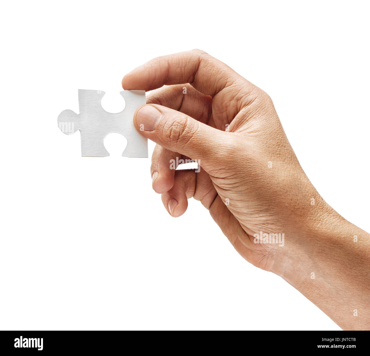 Man holding in hand puzzle element and looks for a solution to