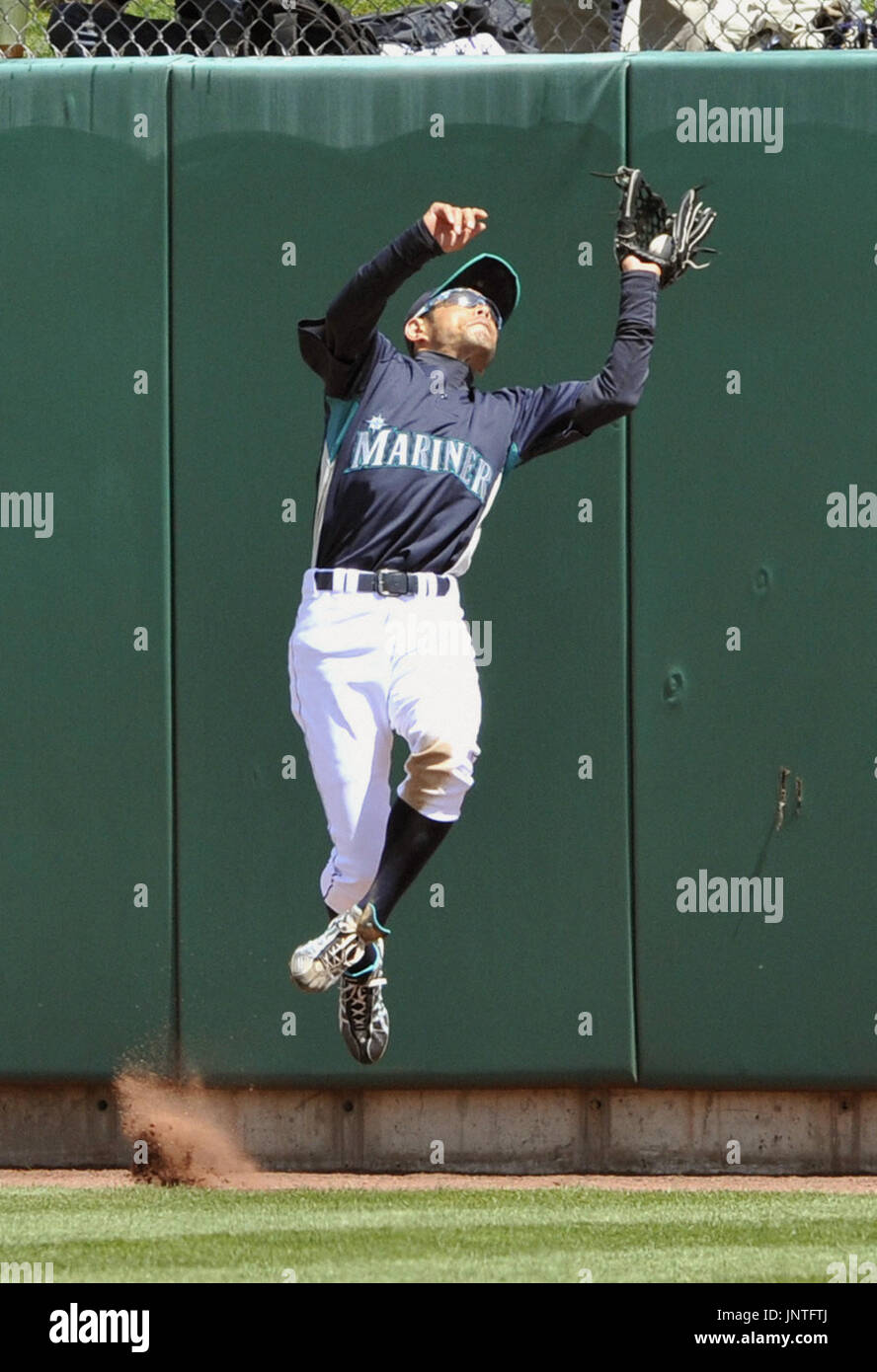 ALBUQUERQUE, United States Seattle Mariners right fielder Ichiro Suzuki leaps to catch a pop