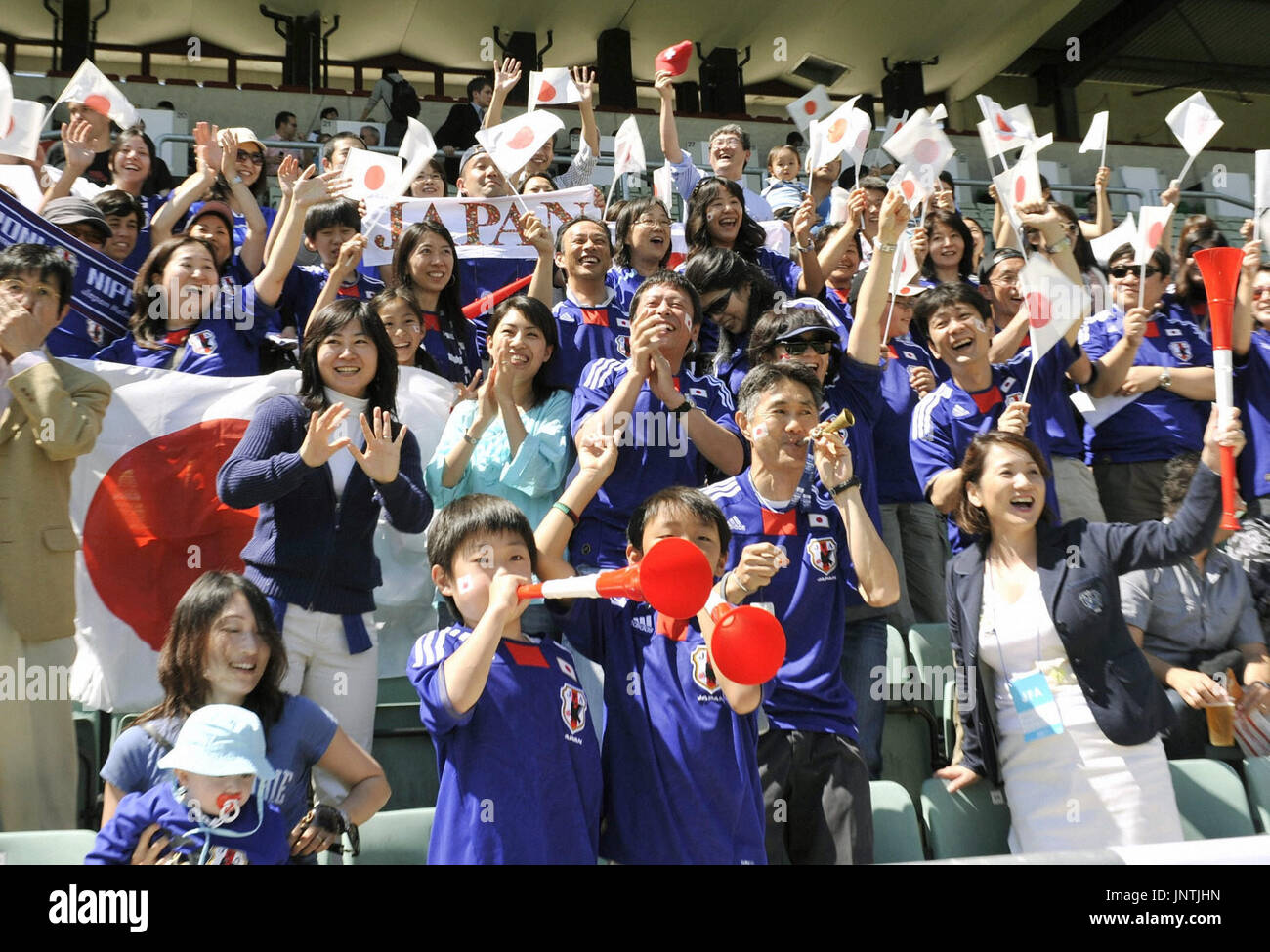 SION, Switzerland - Japanese supporters cheer during a warm-up match  between Japan and Ivory Coast in Sion, Switzerland, on June 4, 2010, before  the FIFA World Cup finals scheduled to begin in