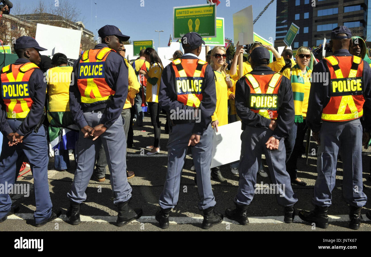 johannesburg-south-africa-police-officers-stand-guard-as-supporters