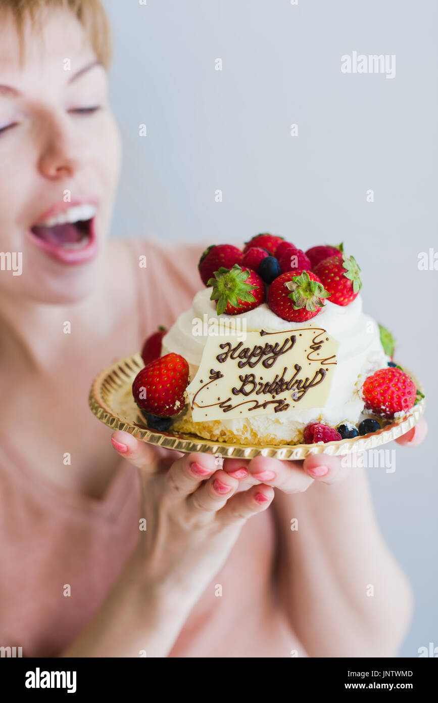 Girl with a birthday cake. Happy lovely young woman holding birthday ...