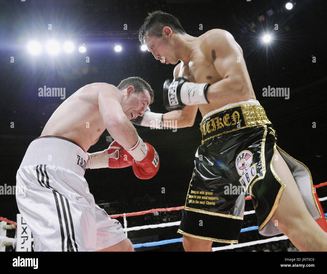 NAGOYA, Japan Challenger Takahiro Ao (R) of Japan lands a punch