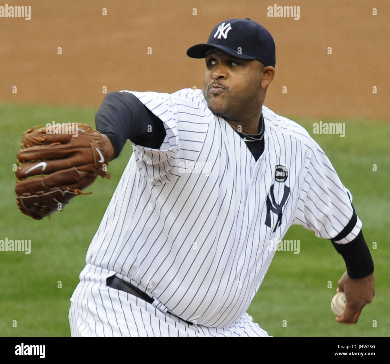 New York Yankees starting pitcher CC Sabathia wipes his face on his shirt  after a rough outing in the Yankees spring training baseball game against  the Washington Nationals at Steinbrenner Field in