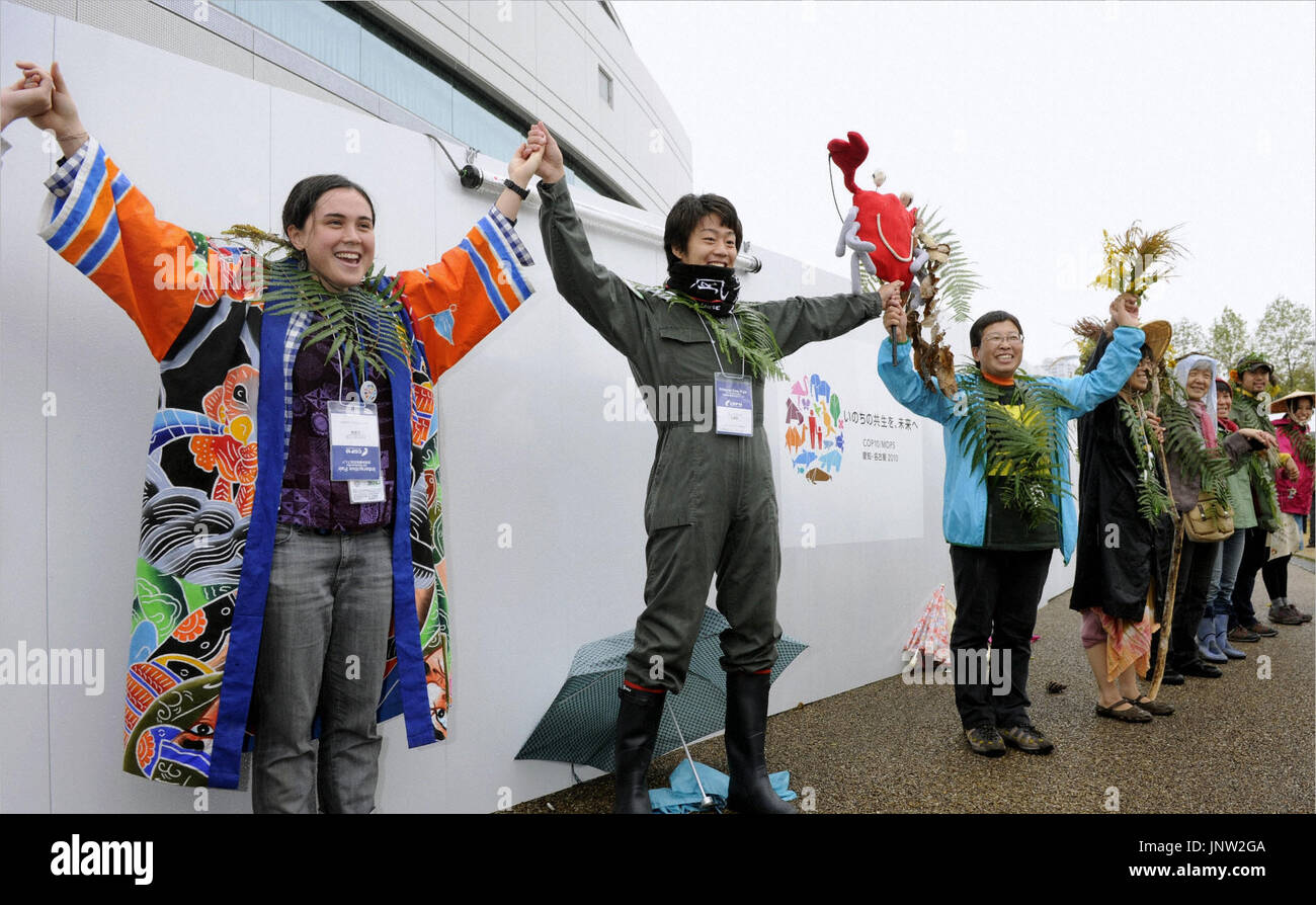 NAGOYA, Japan - People form a human chain near the venue of the U.N ...