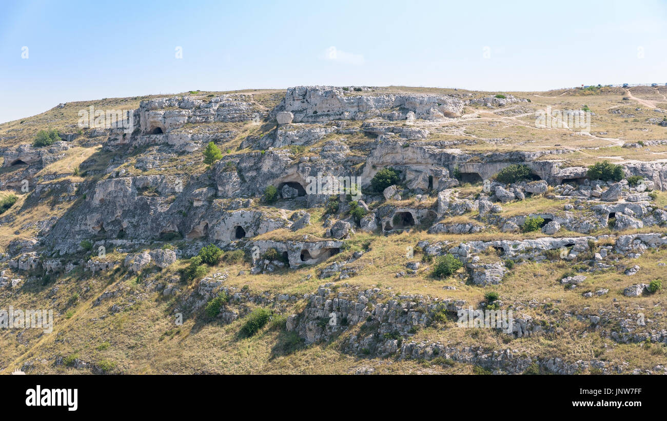 Caves on the side of the Gravina Canyon face Matera. Once used as shelter for shepherds. Basilicata, Italy Stock Photo
