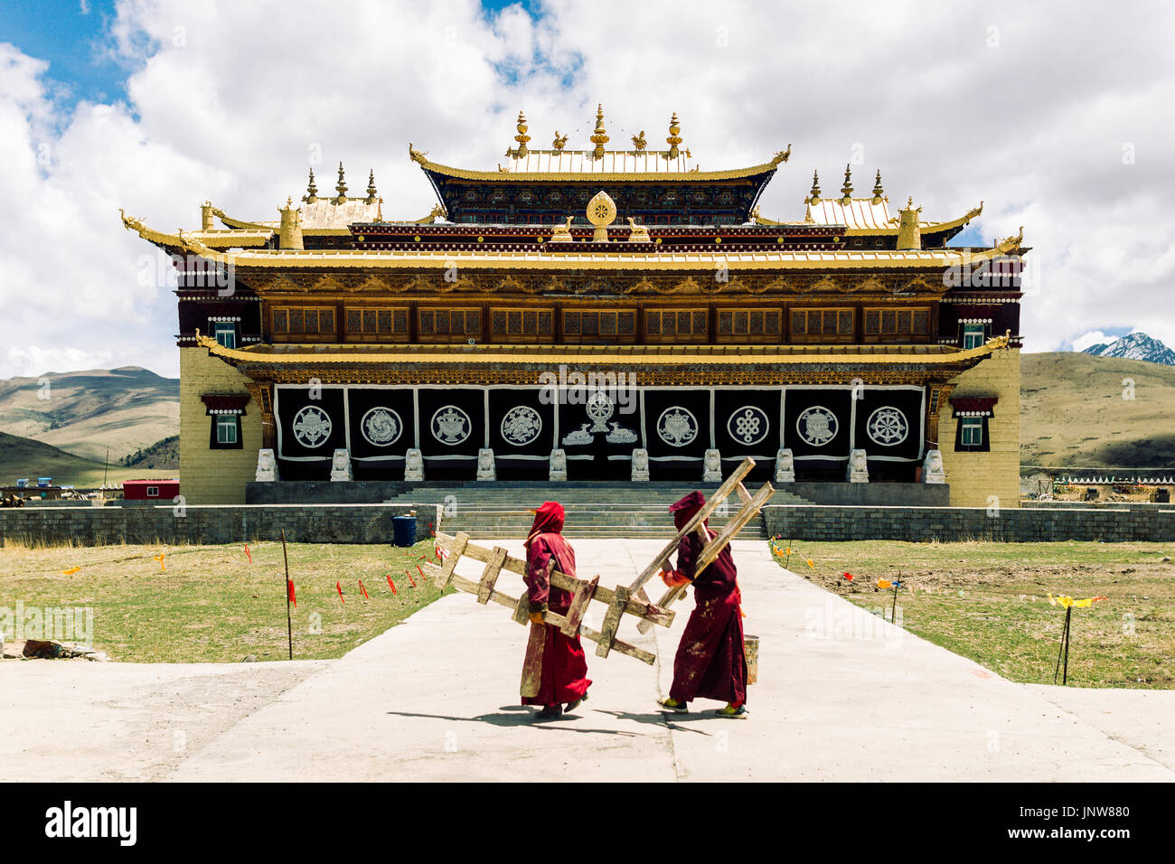 View on tradtitional tibetan monastery by Tagong grassland in China ...