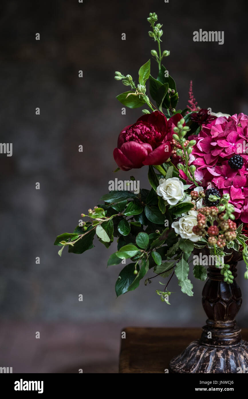 Wedding peony bouquet against vintage dark stone background.. Rustic ...