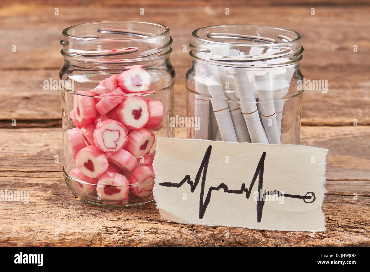 Image of heartbeat, sweets, cigarettes. Stock Photo