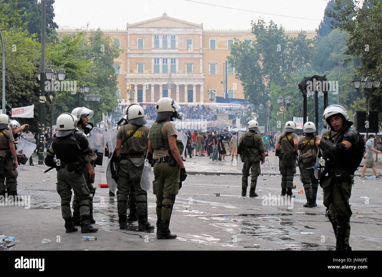 ATHENS, Greece - Riot police officers guard an area near the Greek ...