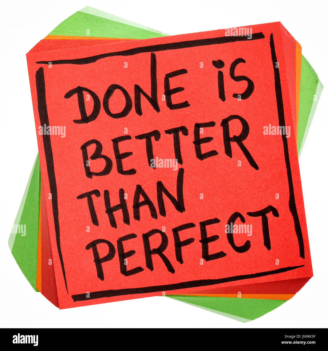 Done is better than perfect reminder - handwriting in black ink on an isolated sticky note Stock Photo