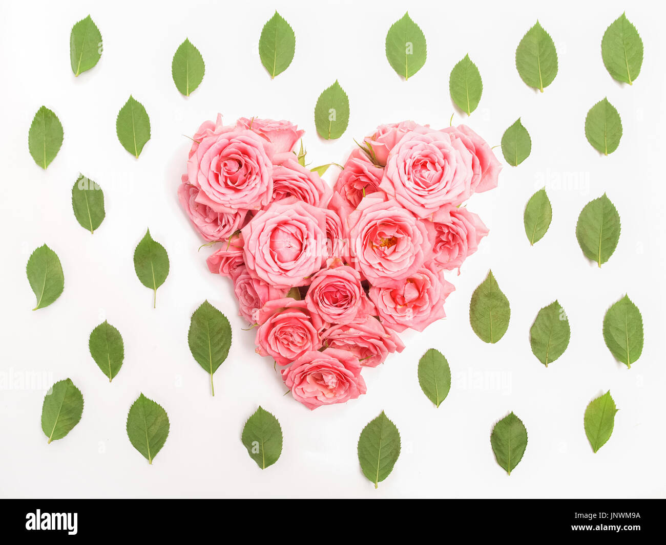 Heart shaped bouquet of roses on white background. Top view Stock Photo ...