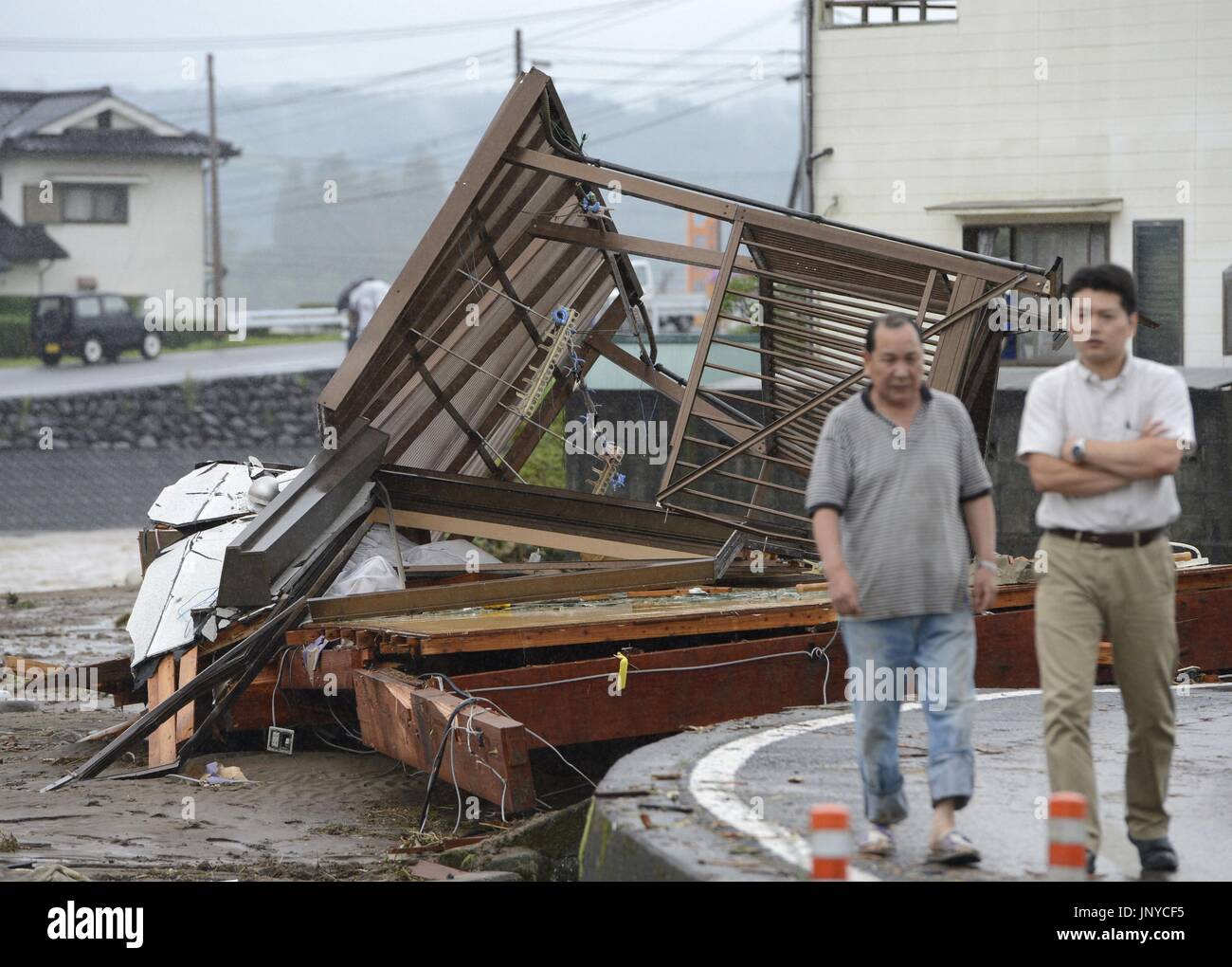 HITA, Japan - Houses are crushed by the swollen Kagetsu River in Hita, Oita Prefecture, as torrential rain hit northern areas of the Kyushu region. (Kyodo) Stock Photo