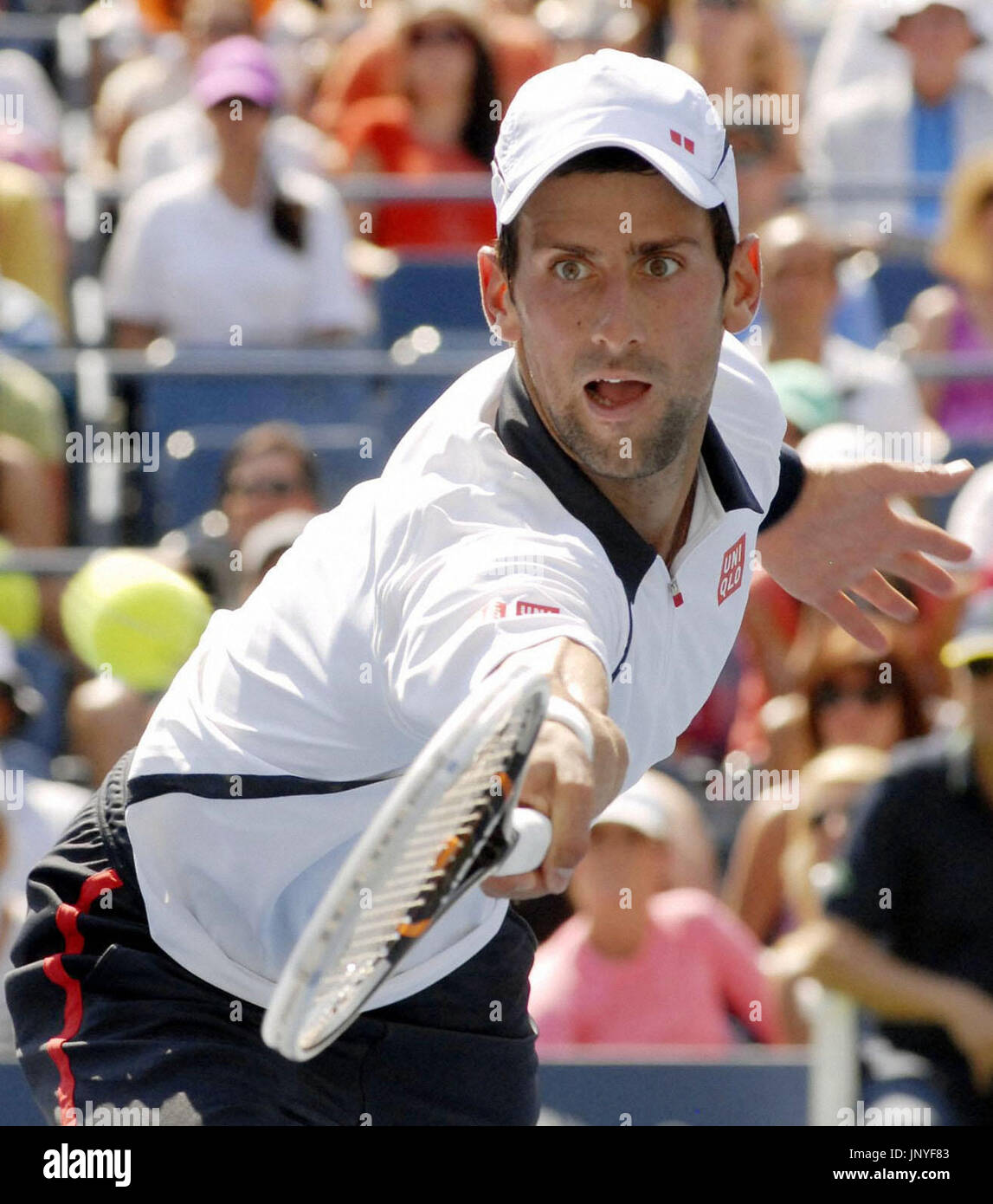 NEW YORK, United States - Serbia's Novak Djokovic plays a shot in his second round men's singles match against Brazil's Rogerio Dutra Silva at the U.S. Open championship in New York on Aug. 31, 2012. Djokovic advanced to the third round. (Kyodo) Stock Photo