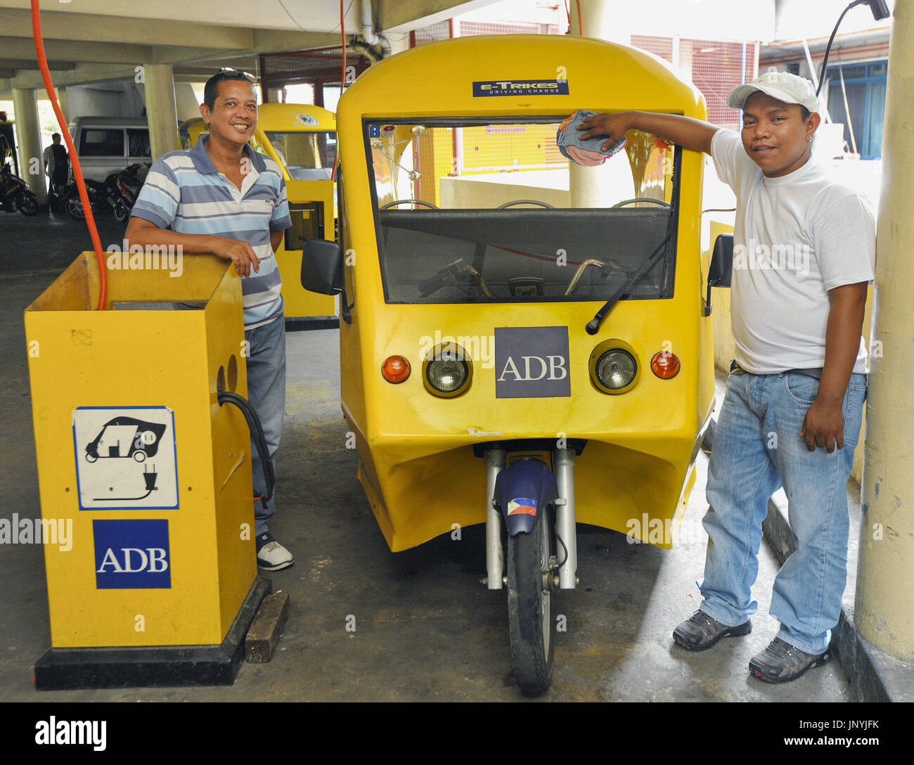MANILA, Philippines An etricycle is charged in metropolitan Manila