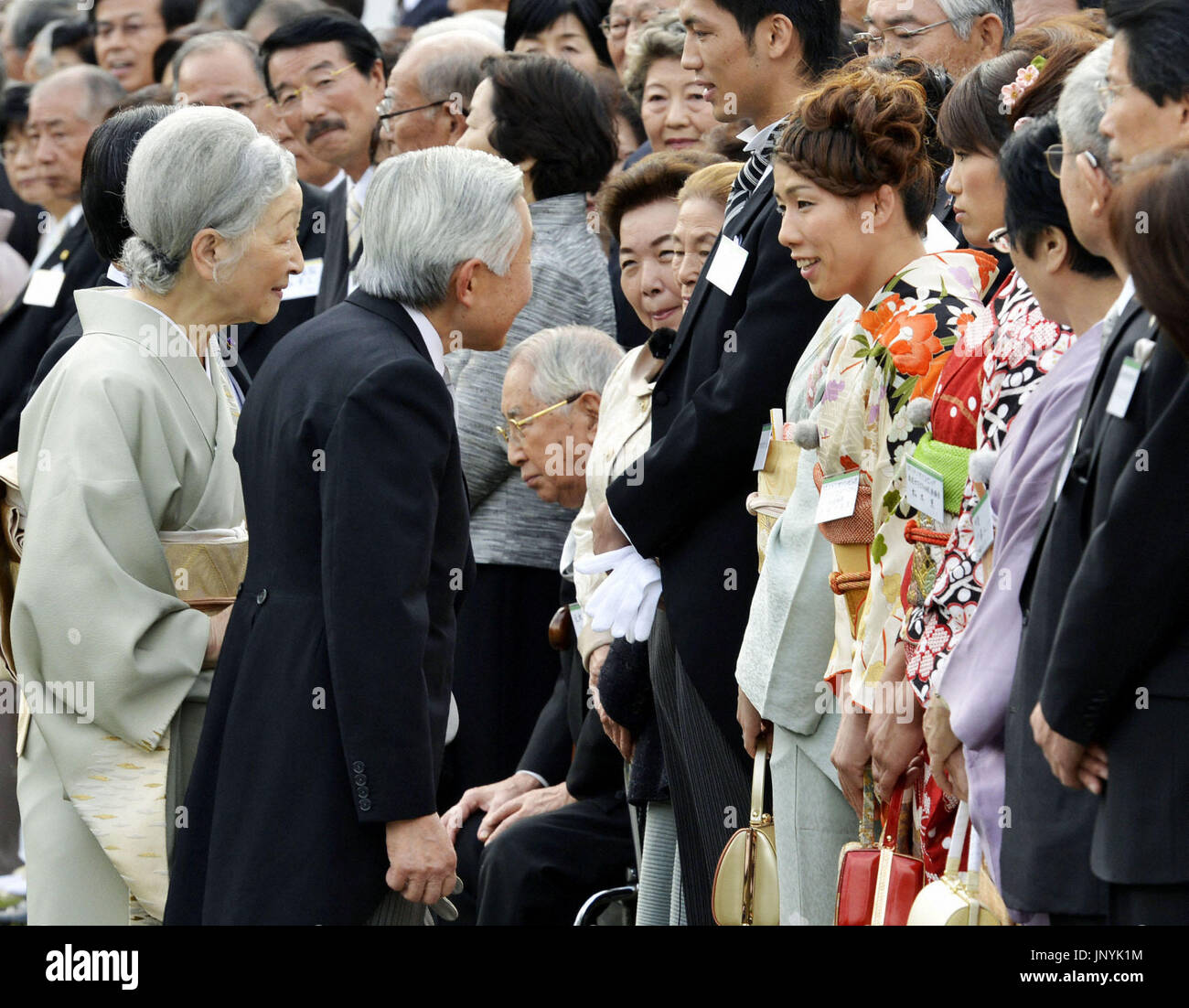 TOKYO, Japan - Emperor Akihito (pictured from behind) and Empress ...