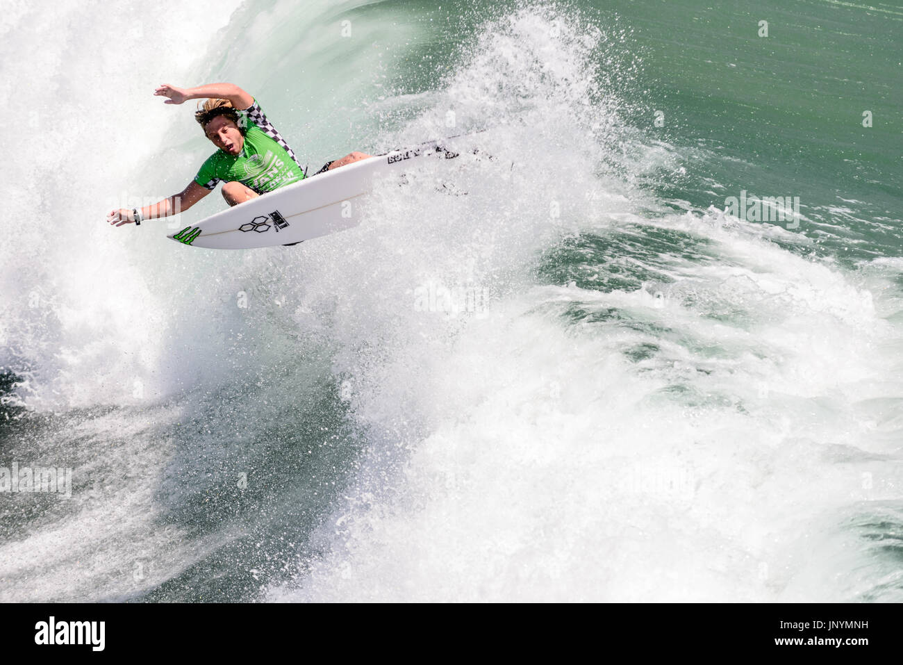 Huntington Beach, USA. 30 July, 2017. Surfer Parker Coffin (USA) competes in the final round of competition at the 2017 VANS US Open of Surfing Trials. Credit: Benjamin Ginsberg/Alamy Live News. Stock Photo