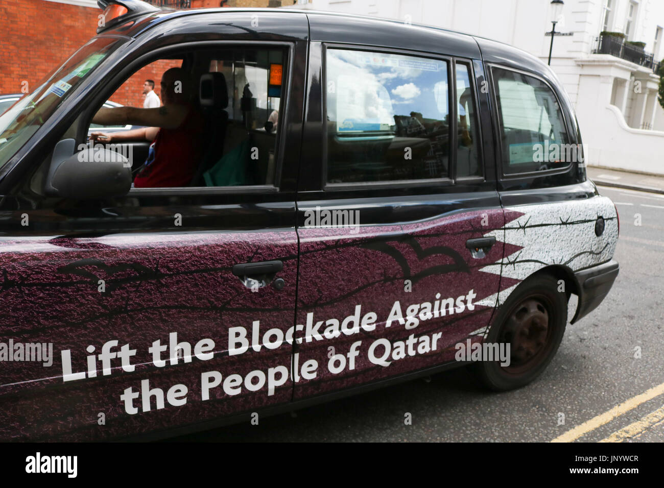 London, UK. 31st July, 2017. A London Taxi with livery calling for the lifting of the economic blockade against the people of Qatar after sanctions were imposed by the Gulf states of Saudi Arabia, Bahrain, Egypt and the United Arab Emirates, which have imposed a land sea air and economic blockade on Qatar since 5 June, accusing the oil rich emirate of supporting terrorism Credit: amer ghazzal/Alamy Live News Stock Photo