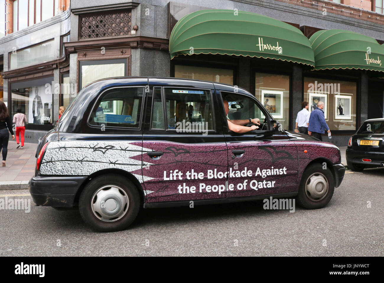London, UK. 31st July, 2017. A London Taxi with livery calling for the lifting of the economic blockade against the people of Qatar after sanctions were imposed by the Gulf states of Saudi Arabia, Bahrain, Egypt and the United Arab Emirates, which have imposed a land sea air and economic blockade on Qatar since 5 June, accusing the oil rich emirate of supporting terrorism Credit: amer ghazzal/Alamy Live News Stock Photo