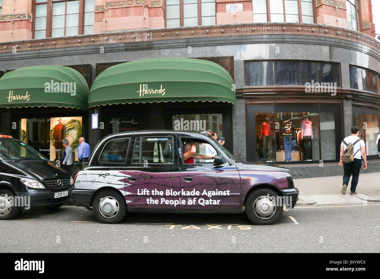 London, UK. 31st July, 2017. A London Taxi with livery calling for the lifting of the economic blockade against the people of Qatar after sanctions were imposed by the Gulf states of Saudi Arabia, Bahrain, Egypt and the United Arab Emirates, which have imposed a land sea air and economic blockade on Qatar since 5 June, accusing the oil rich emirate of supporting terrorism Credit: amer ghazzal/Alamy Live News Stock Photo