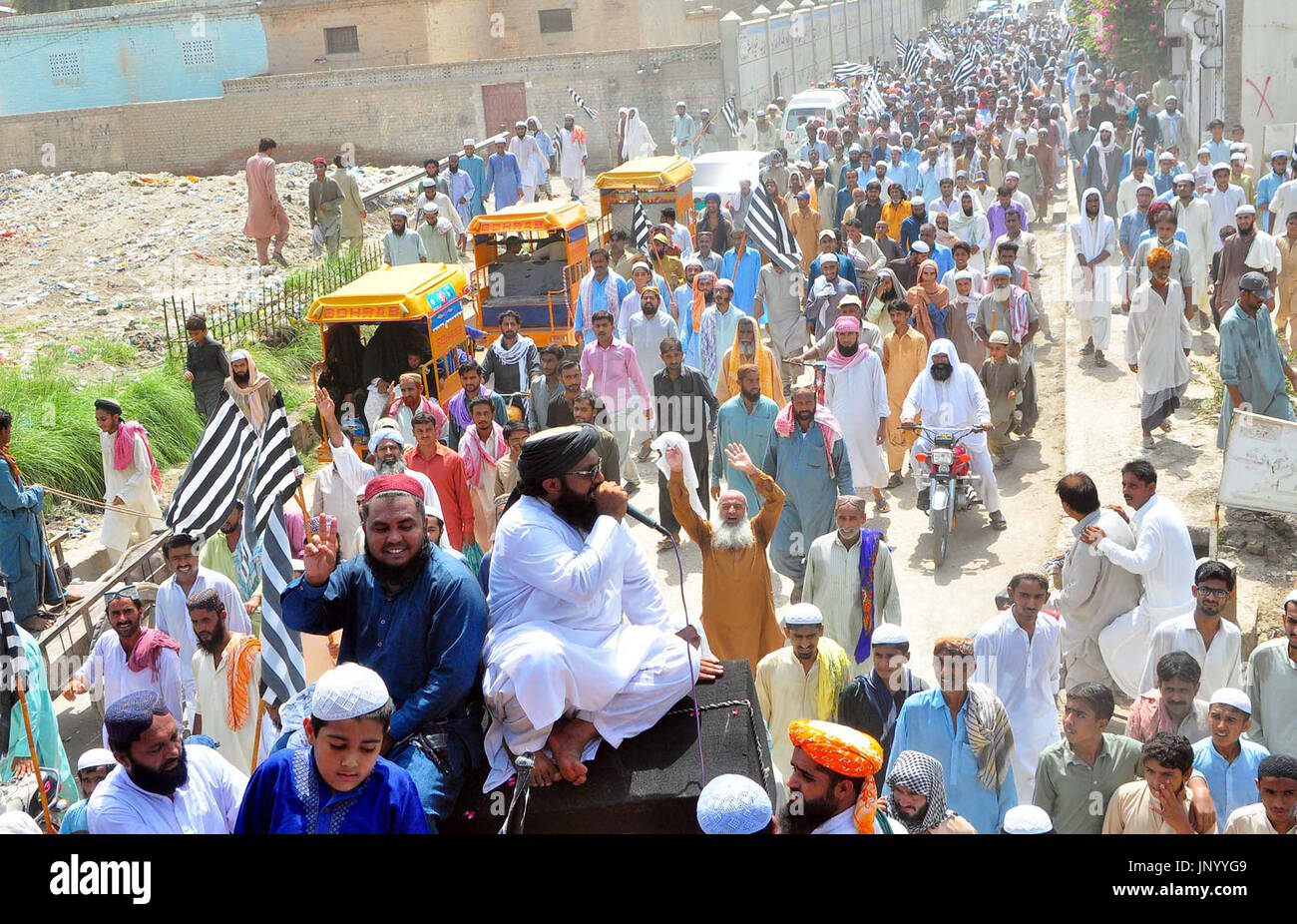 Activists of Jamiat Ulema-e-Islam (JUI-F) are holding protest rally against worst electricity load shedding, at Stadium road in Larkana on Monday, July 31, 2017. Stock Photo