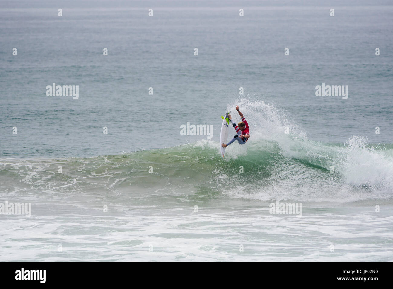 Huntington Beach, USA. 31 July, 2017. Kolohe Andino (USA), currently ranked 14th on the WSL Championship Tour, sails through round 2 of competition at the 2017 VANS US Open of Surfing. Credit: Benjamin Ginsberg/Alamy Live News. Stock Photo