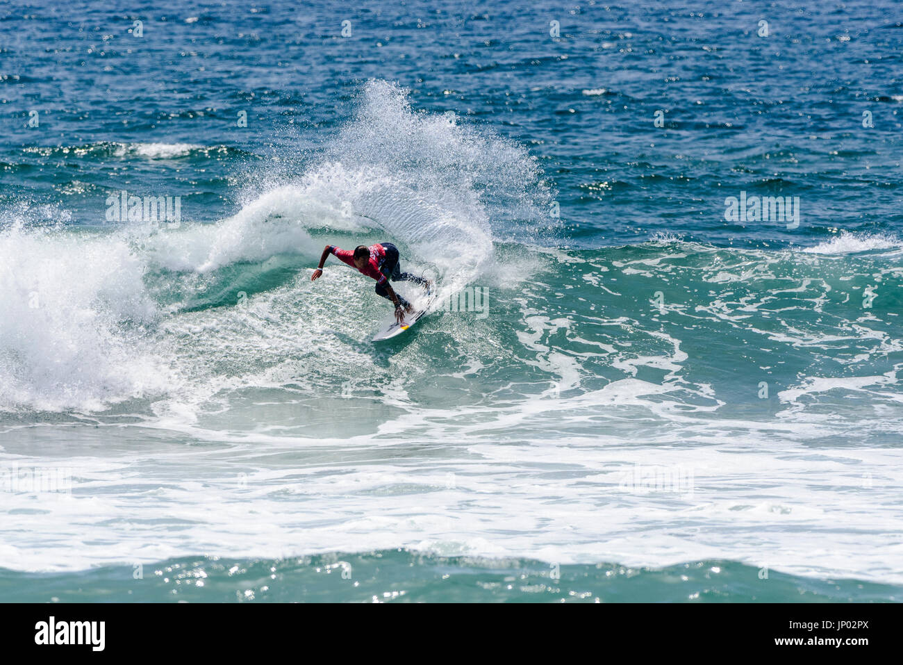 Huntington Beach, USA. 31 July, 2017. Kanoa Igarashi (USA) competes in round 2 of competition at the 2017 VANS US Open of Surfing. Credit: Benjamin Ginsberg/Alamy Live News. Stock Photo