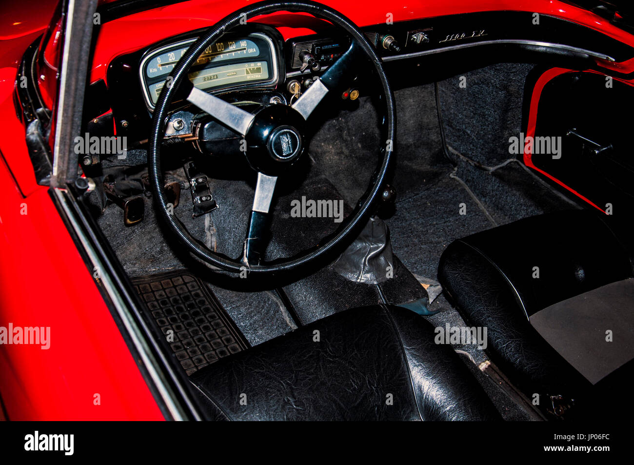 interior of red color classic car in the museum Stock Photo