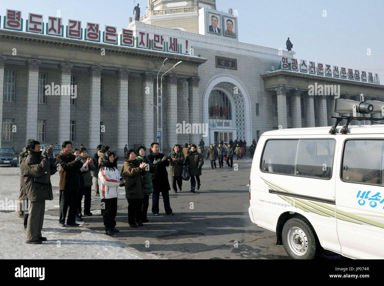 Pyongyang Vehicles PYONGYANG, North Korea - People clap hands in front of Pyongyang ...