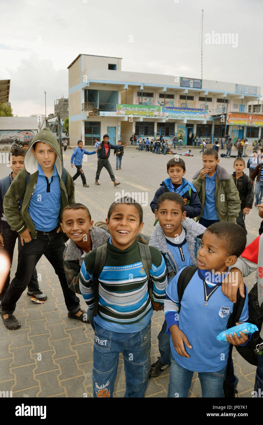 GAZA, Palestinian Authority - Photo taken on Nov. 24, 2012, shows children at an elementary school in the Palestinian self-governing area of Gaza, which reopened after a cease-fire agreement between Israel and Hamas was reached. Israeli airstrikes against Gaza had continued for eight days from Nov. 14. (Kyodo) Stock Photo