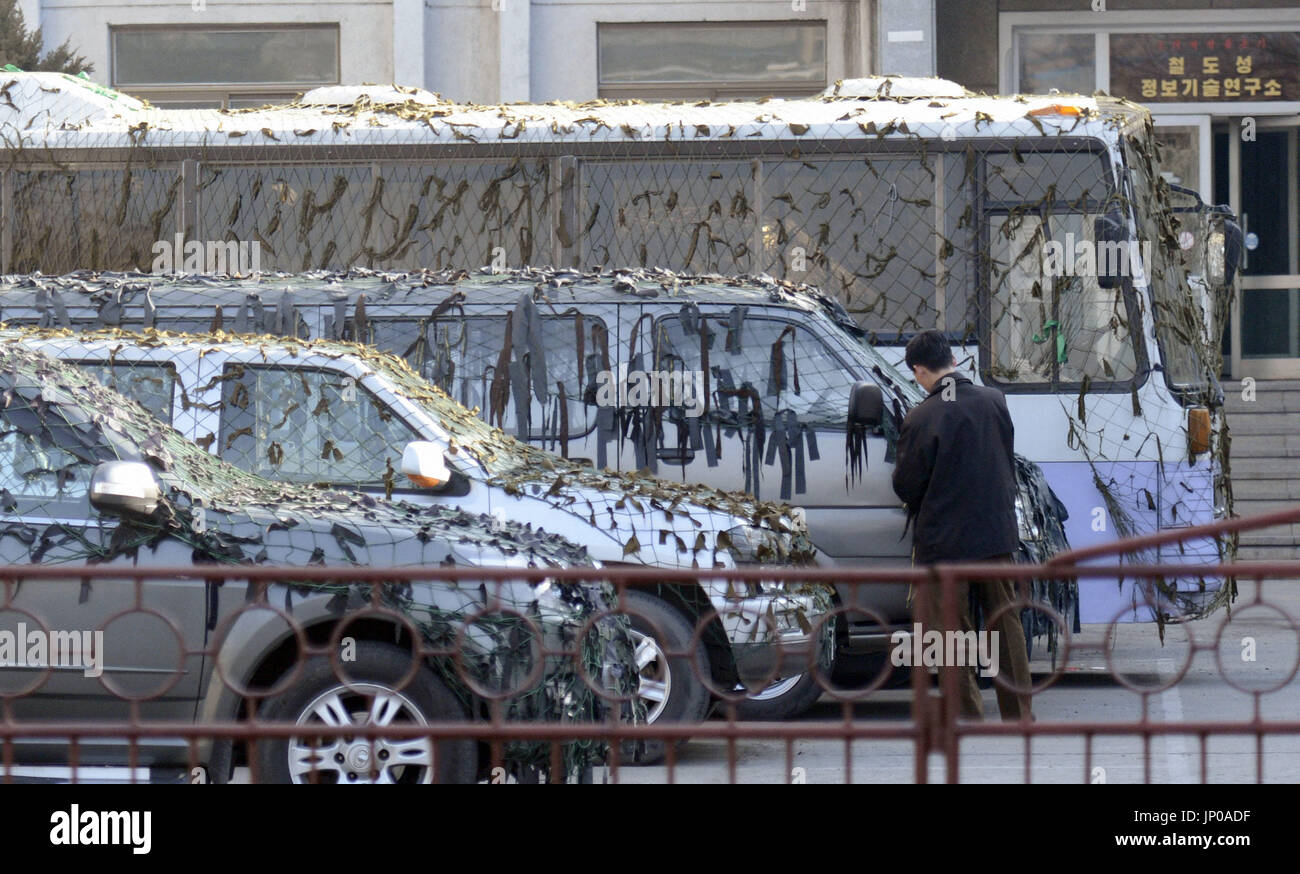 Pyongyang Vehicles PYONGYANG, North Korea - Vehicles are covered with camouflage nets in ...