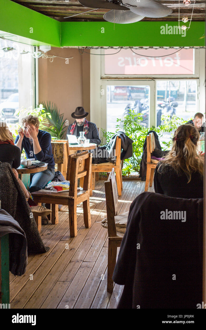 Paris, France - March 2, 2016: Customers in La Cafeotheque of Paris on rue Hotel de Ville, specialty coffee roasting and cafe. Stock Photo