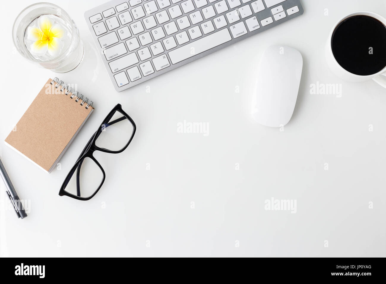 Modern white office desk top table with computer laptop, cup of coffee ...