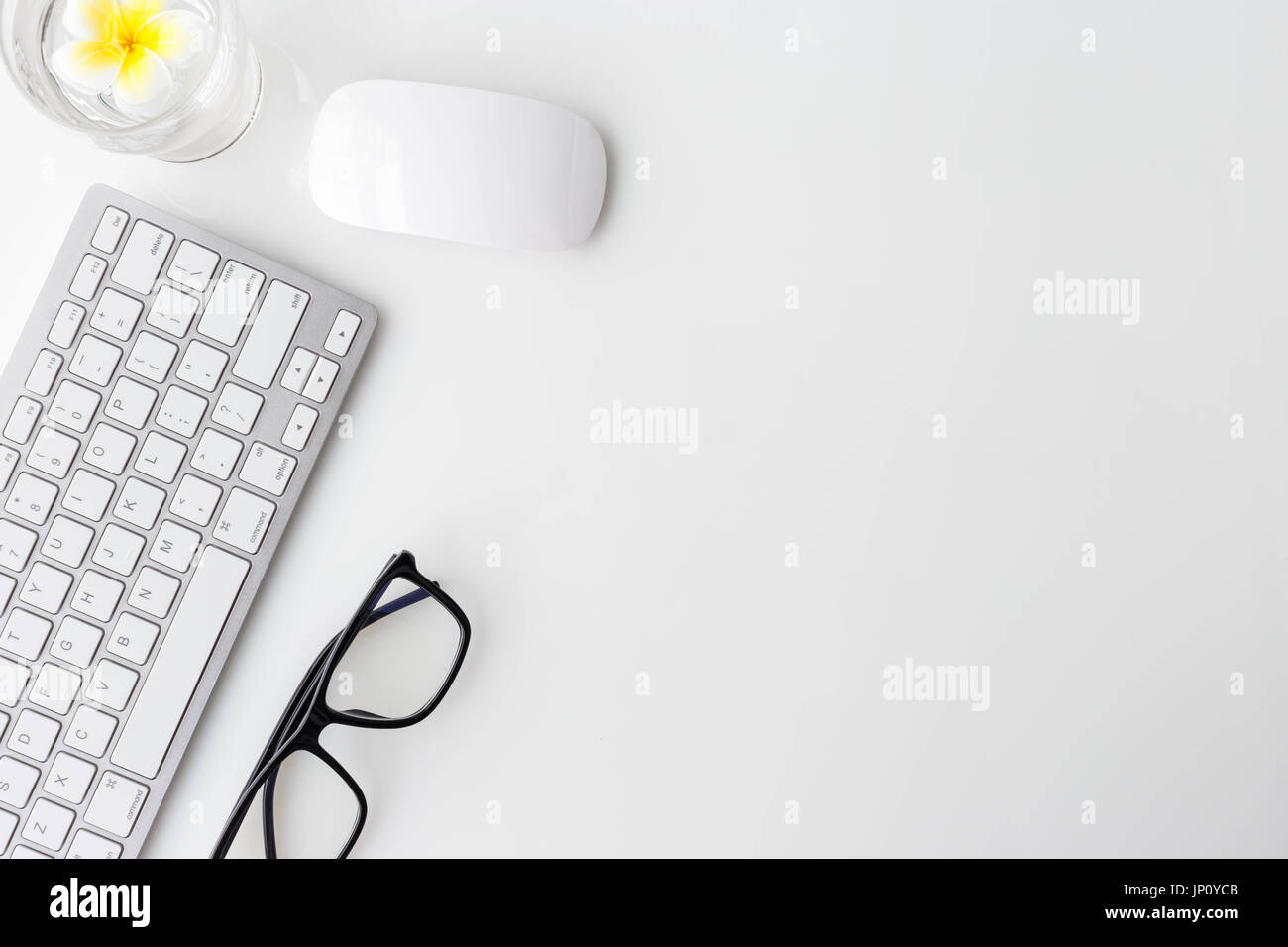 Modern white office desk top table with computer laptop, notebook and